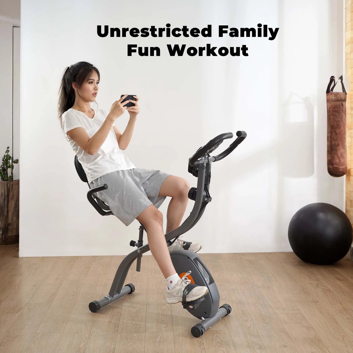 Folding exercise bike with LCD monitor, pulse sensor, recumbent seat, and arm resistance bands for indoor use